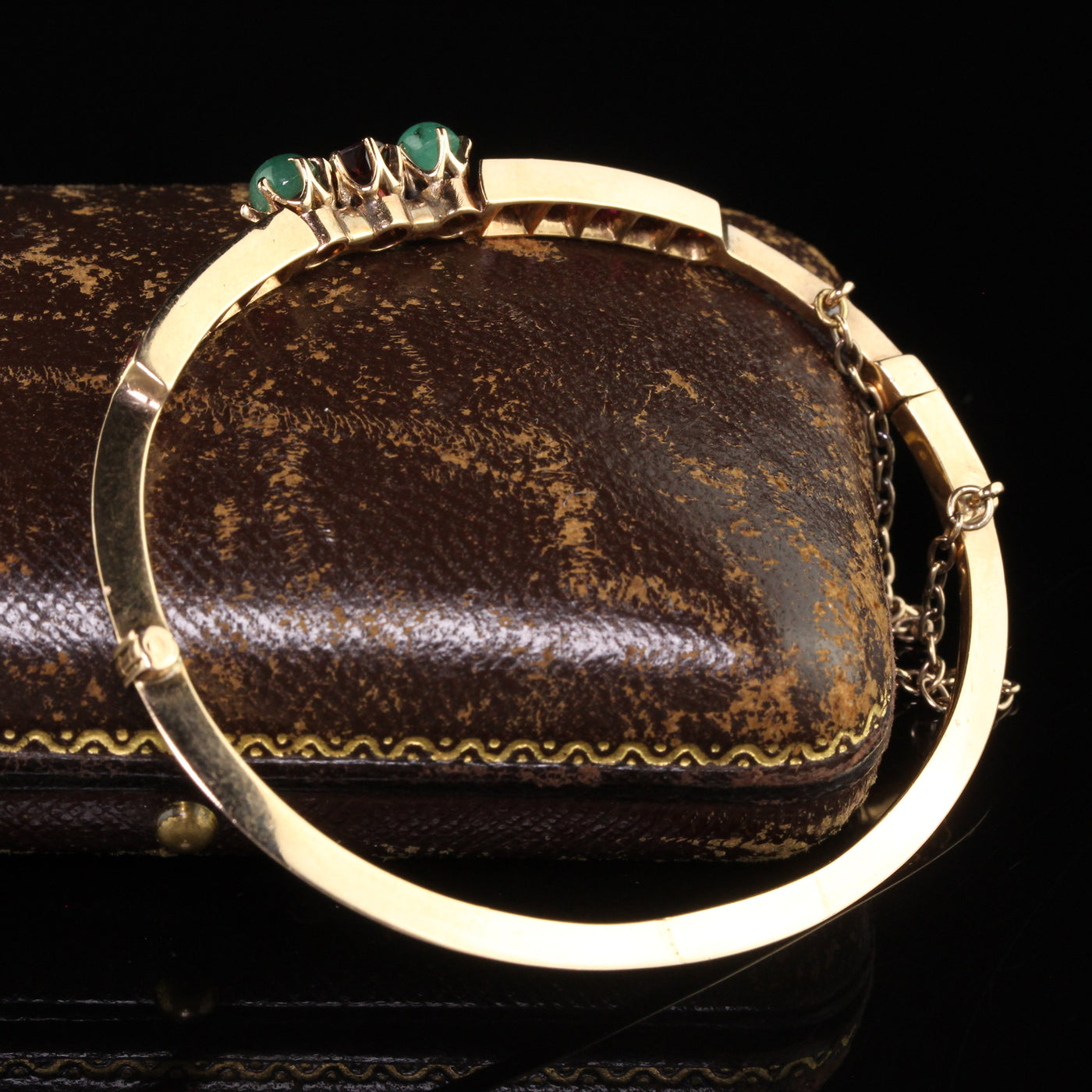 Antique Victorian 15K Yellow Gold Garnet and Emerald Bangle Bracelet
