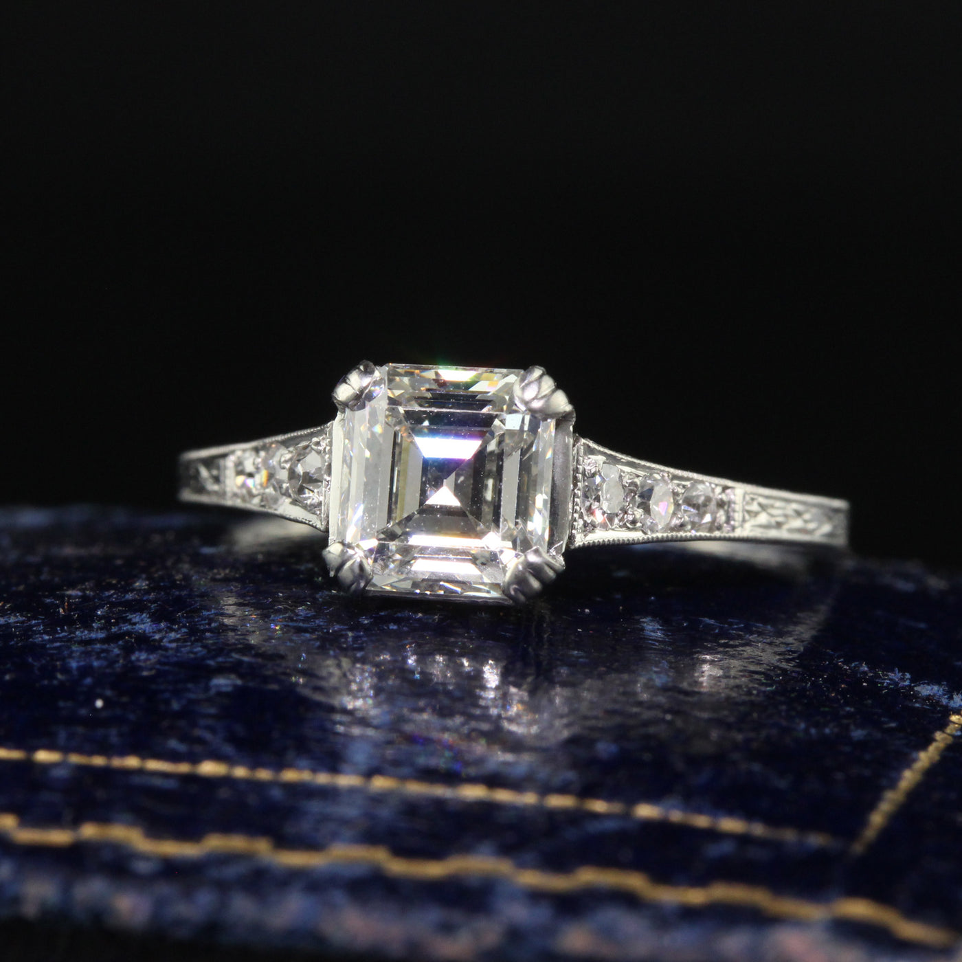 Exquisite platinum ring with emerald cut ruby -