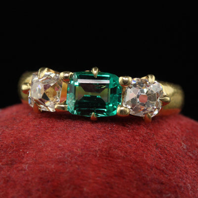 Antique Victorian 18K Yellow Gold Peruzzi Cut Diamond Emerald Three Stone Ring