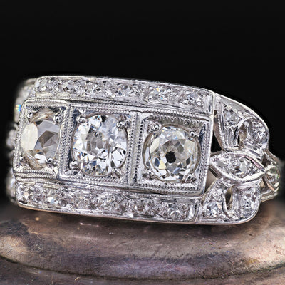 Antique Art Deco Platinum Old Mine Diamond Three Stone Ribbon Motif Ring